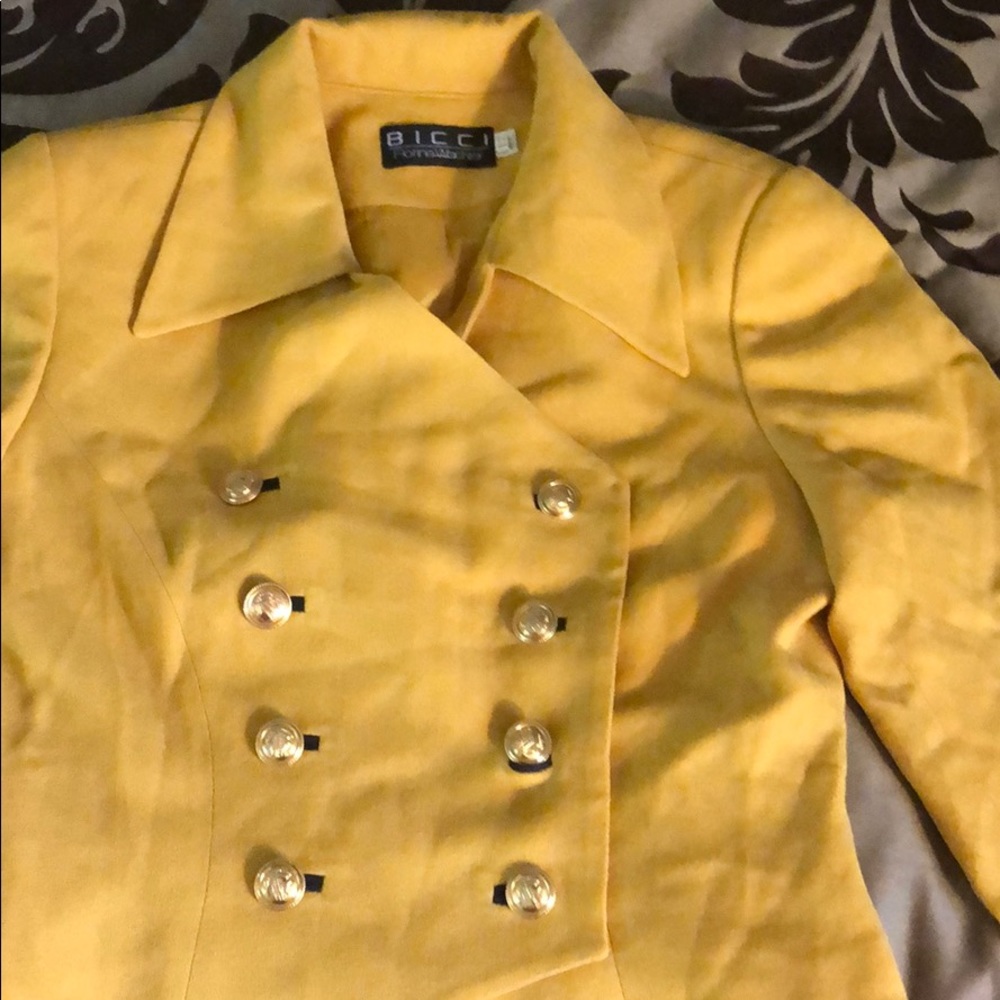 Yellow uniform jacket with gold buttons